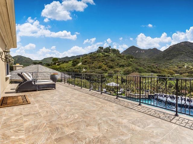 view of patio / terrace with a mountain view