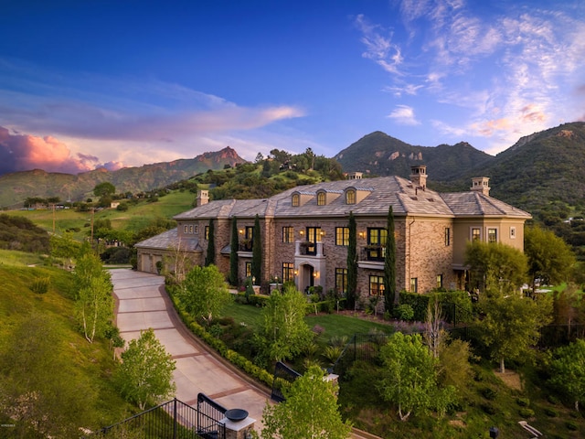 view of front of property with a mountain view