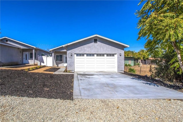 ranch-style home featuring a garage