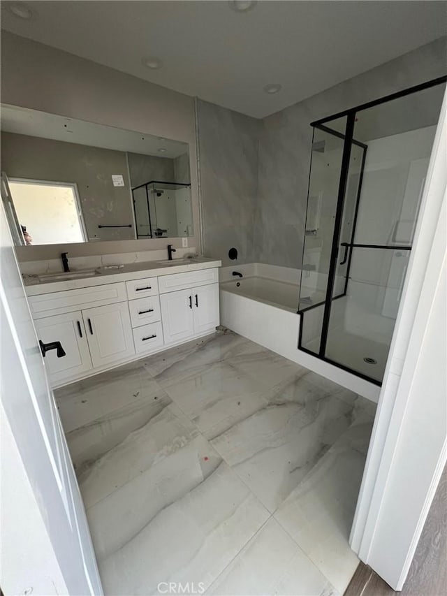 bathroom featuring vanity and plus walk in shower