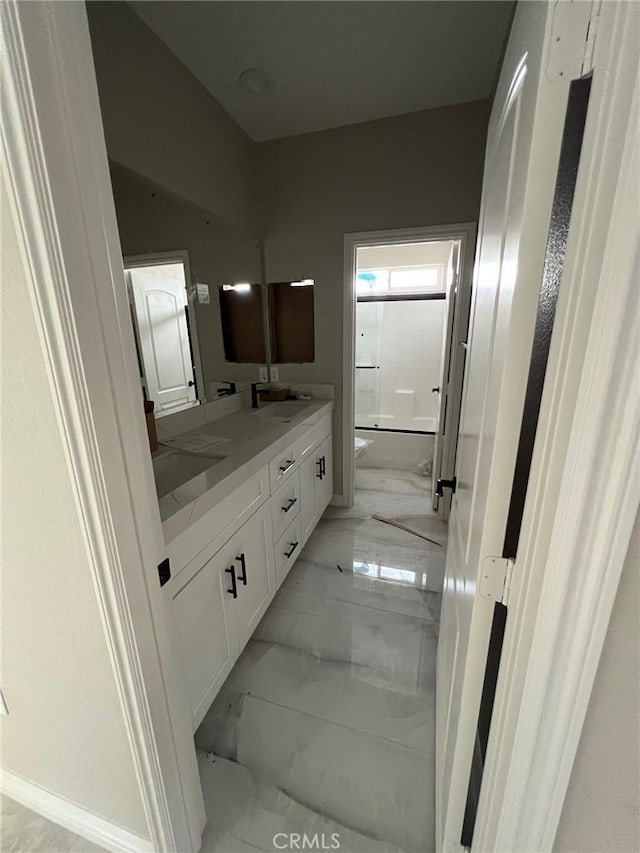 bathroom with vanity and shower / washtub combination