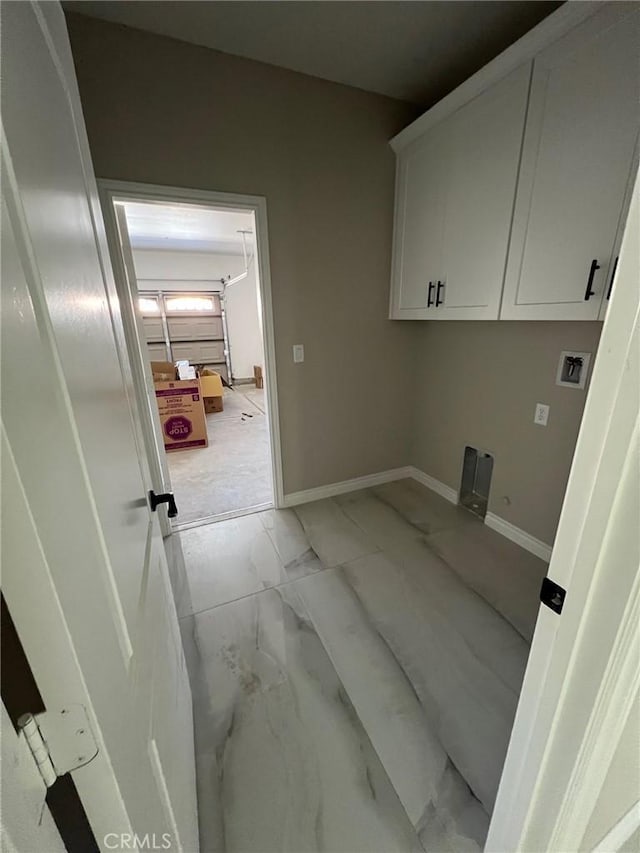 laundry area with cabinets, hookup for a washing machine, and hookup for an electric dryer