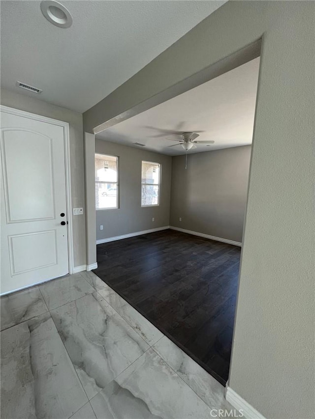 unfurnished room featuring ceiling fan