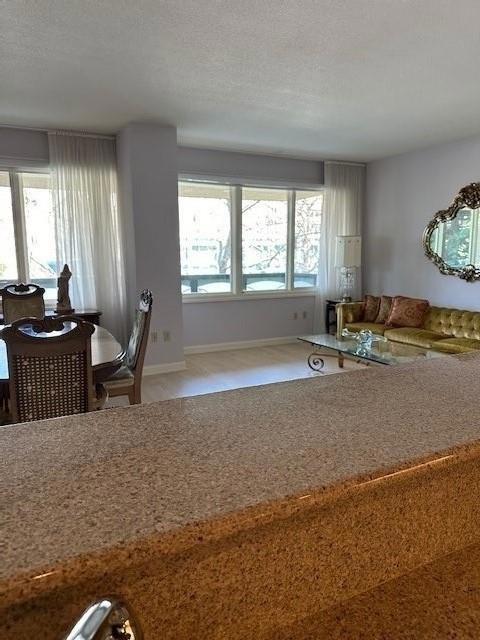 kitchen featuring carpet floors and a textured ceiling