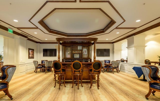 bar featuring light colored carpet, ornamental molding, and white cabinetry