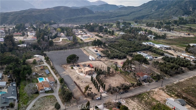 birds eye view of property featuring a mountain view