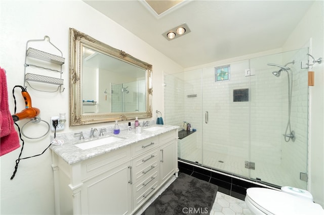 bathroom with walk in shower, tile patterned flooring, vanity, and toilet