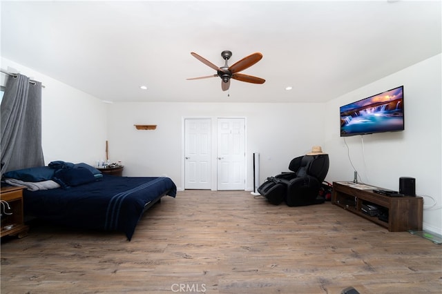 bedroom featuring ceiling fan and hardwood / wood-style flooring