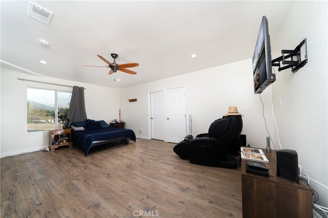 bedroom featuring ceiling fan and hardwood / wood-style flooring