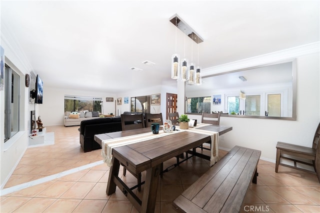 tiled dining room with crown molding