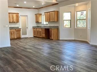 15808 Zurich Way, Pine Mountain Club, CA 93222 - kitchen featuring brown cabinetry, plenty of natural light, baseboards, dark wood-style flooring, and recessed lighting