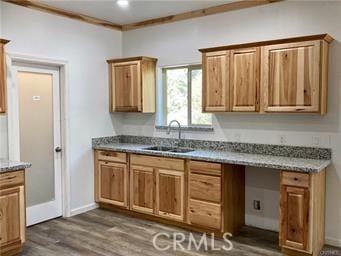 15808 Zurich Way, Pine Mountain Club, CA 93222 - kitchen featuring a sink, dark wood-style floors, baseboards, and brown cabinets