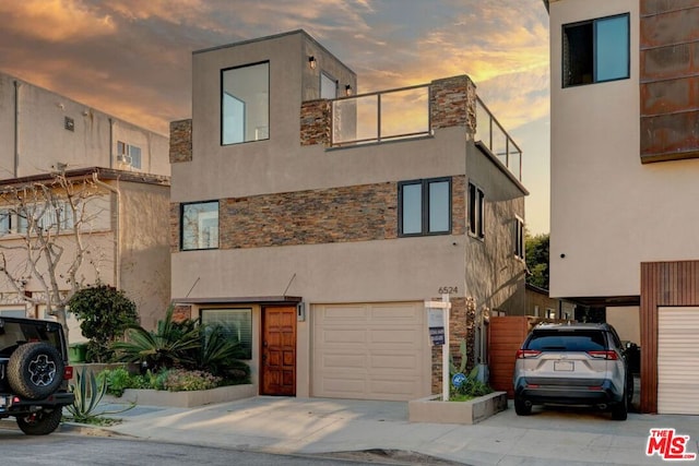 view of front of property featuring a garage