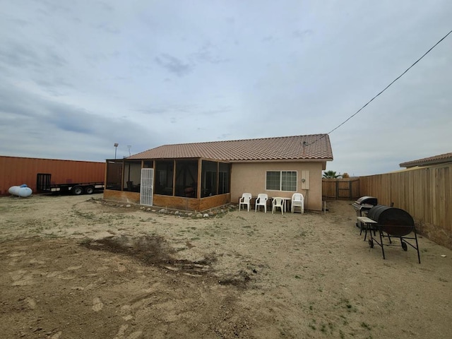 rear view of house with a sunroom