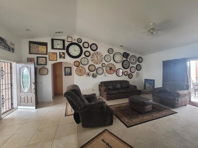 tiled living room with lofted ceiling