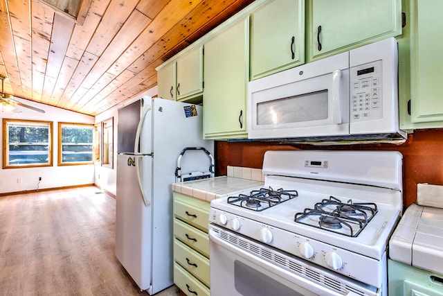 kitchen with vaulted ceiling, green cabinets, white appliances, tile countertops, and wooden ceiling