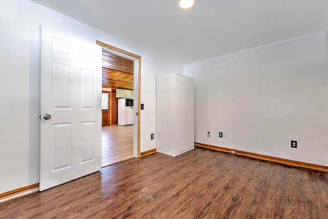 empty room featuring hardwood / wood-style flooring