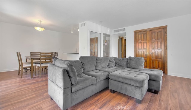 living room with wood-type flooring