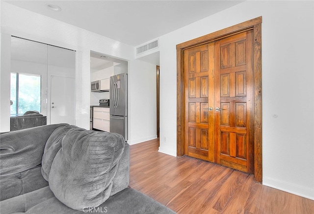 living room with hardwood / wood-style flooring