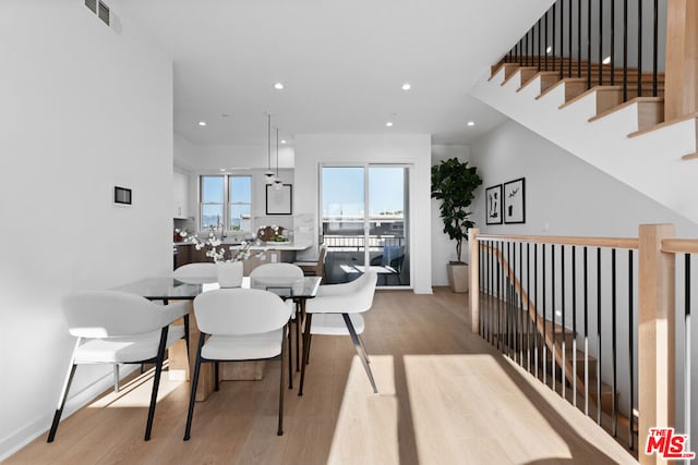 dining room featuring light hardwood / wood-style flooring