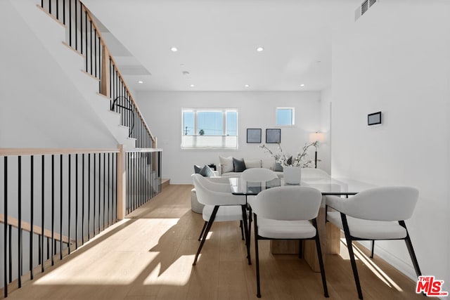 dining area with hardwood / wood-style floors