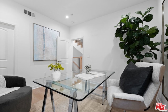 home office featuring hardwood / wood-style flooring