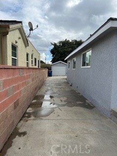 view of home's exterior featuring a garage and an outdoor structure