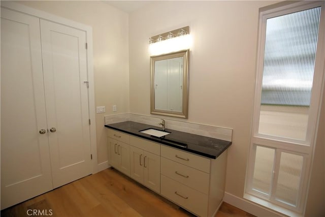 bathroom featuring vanity and hardwood / wood-style flooring