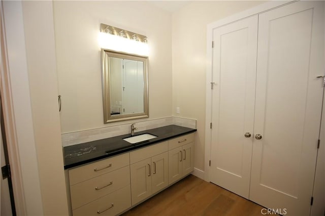 bathroom with vanity and hardwood / wood-style flooring