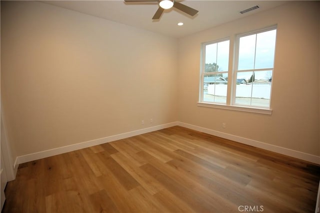 unfurnished room featuring ceiling fan and wood-type flooring