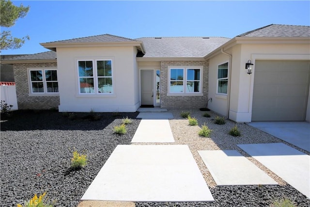 ranch-style home featuring a garage