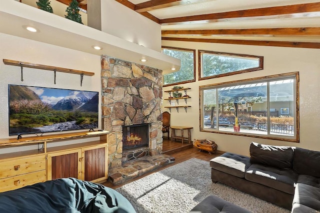 living room with vaulted ceiling with beams, dark hardwood / wood-style floors, and a fireplace