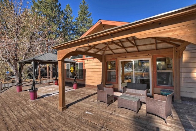 wooden deck with outdoor lounge area and a gazebo