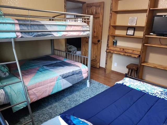 bedroom featuring wood-type flooring