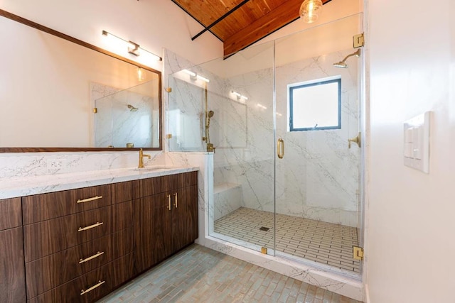 bathroom with vaulted ceiling with beams, vanity, an enclosed shower, and wooden ceiling