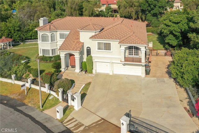 view of front of house featuring a front lawn and a garage