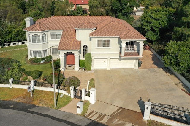 view of front facade featuring a garage and a front lawn