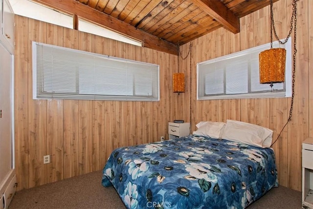 carpeted bedroom with beam ceiling, wood walls, and wooden ceiling