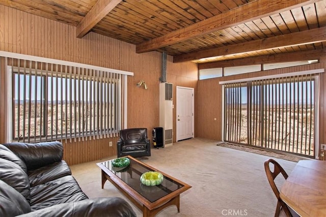 living room featuring wooden ceiling, light carpet, wood walls, and vaulted ceiling with beams