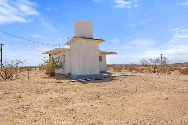 view of home's exterior featuring a rural view