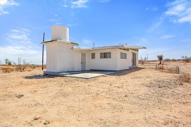 rear view of property with a patio area