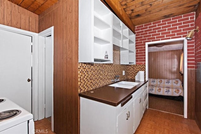 kitchen with light parquet floors, white electric range, white cabinets, and wooden ceiling