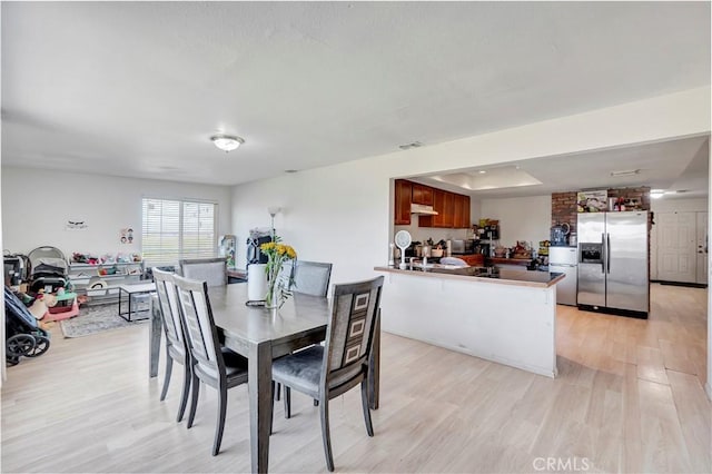 dining space featuring light hardwood / wood-style flooring