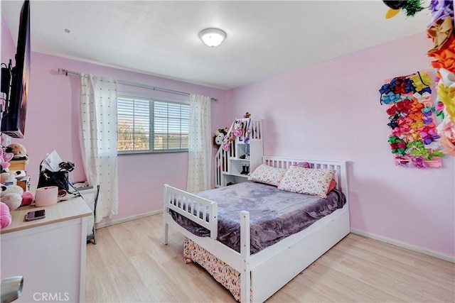 bedroom featuring light hardwood / wood-style flooring