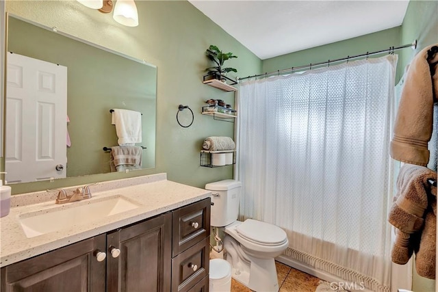 full bathroom featuring toilet, shower / tub combo, vanity, and tile patterned floors