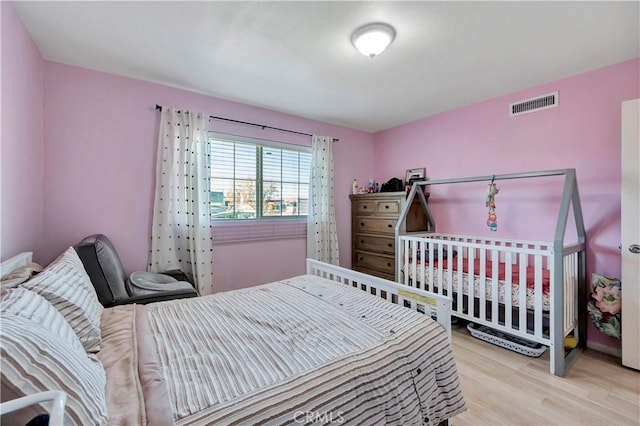 bedroom with light wood-type flooring