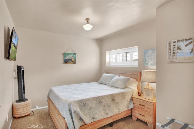 bedroom featuring light colored carpet