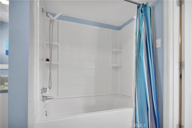 bathroom with shower / tub combo with curtain