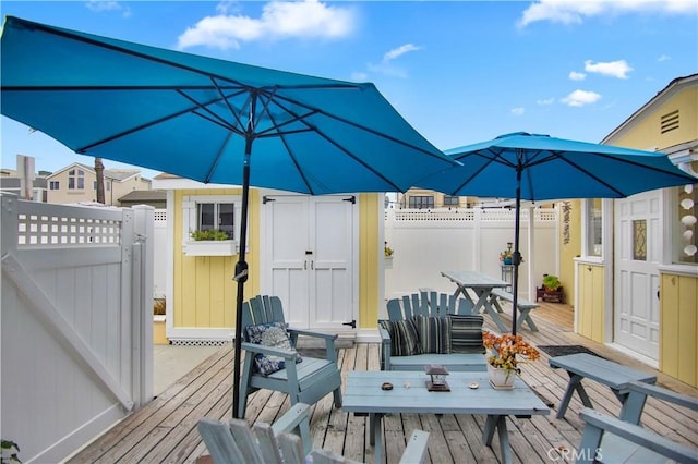 wooden deck with a storage unit