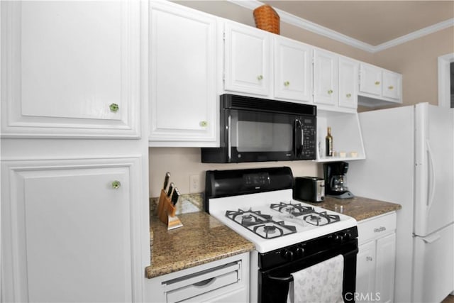 kitchen with dark stone countertops, white cabinets, white appliances, and ornamental molding